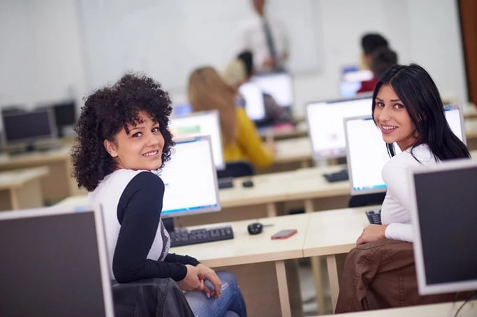 technology students group in computer lab classroom